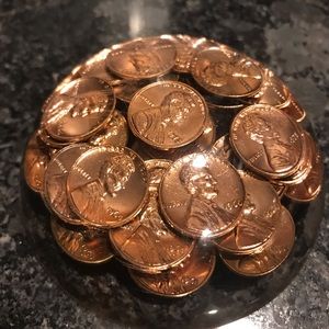 Vintage acrylic  paperweight with 1973 pennies